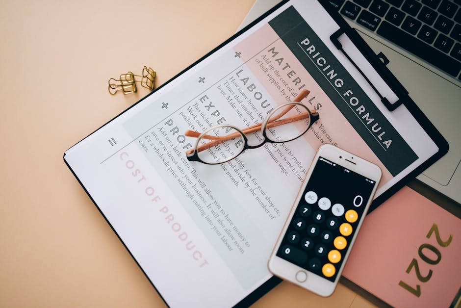 A close-up image shows a printed pricing formula sheet on a clipboard, with the heading 'PRICING FORMULA' visible at the top. Resting on the sheet are a pair of eyeglasses with thin black frames, posi